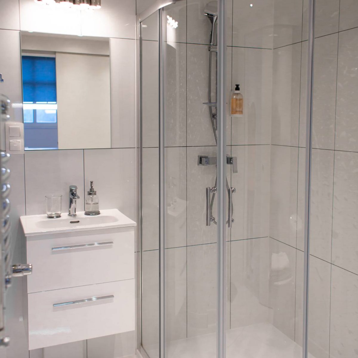 clean modern bathroom with glass shower doors
